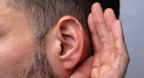 Close-up Of A Man Trying To Hear